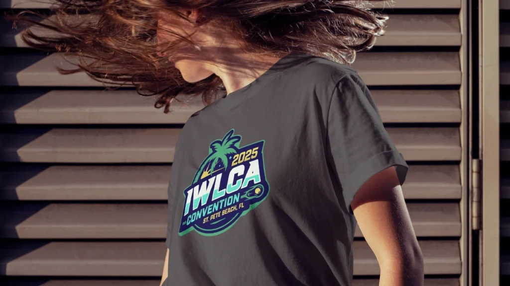 A woman enjoying her new IWLCA conference shirt